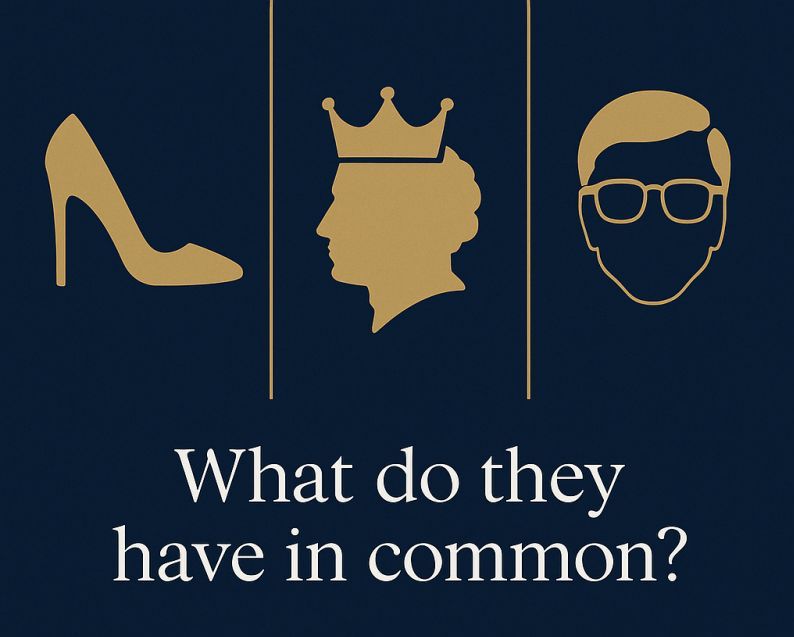 A group of about a dozen people stand together in a lecture hall after an event or meeting, posing for a photo together against the backdrop of the stage.