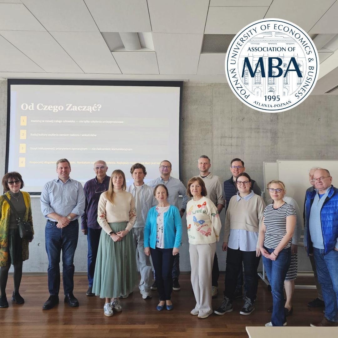 Group photo of participants at a university workshop, standing in front of a presentation screen, with the MBA Association logo displayed in the upper-right corner.